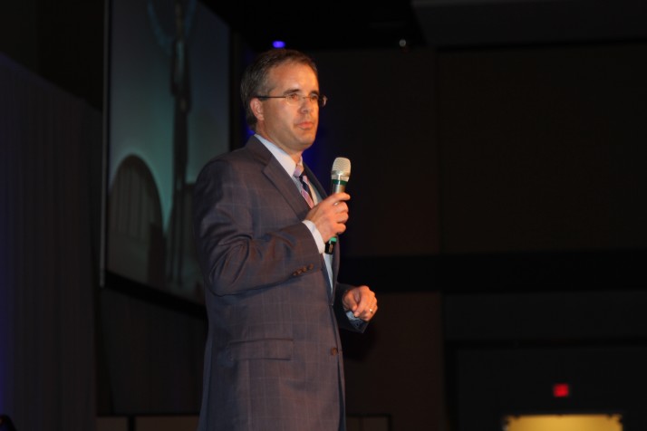 Dan Schipfer, president of the SM Education Foundation, greets guests at the annual Fall Breakfast.