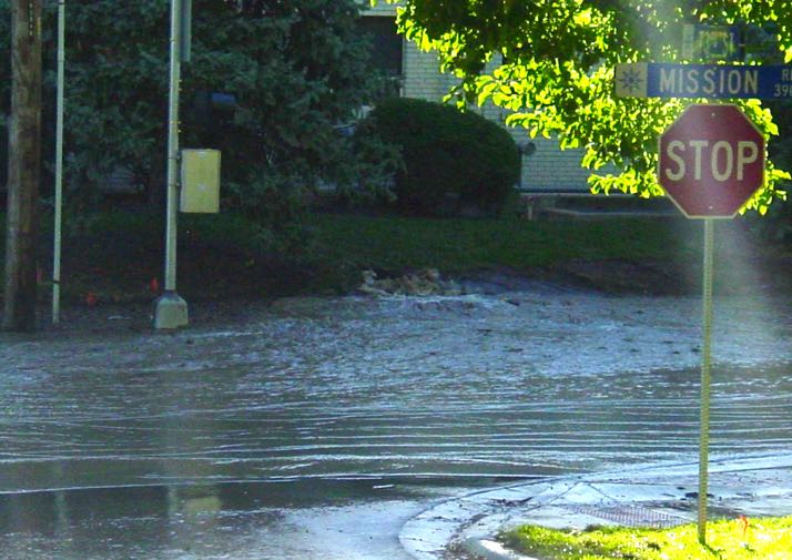 Water flooded the street this morning. Photo by Dave Gergick