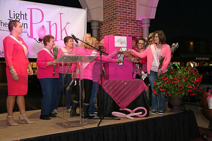 A group of cancer survivors and advocates helped flip the switch on the pink lights. Photo courtesy Parris Communications.