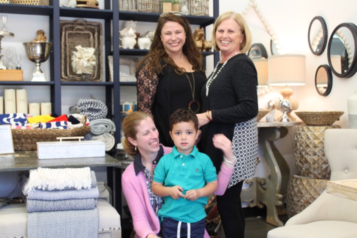 Megan Redmond and her son Finn are backed by Sara Dapp (left) and Jo Ann Dapp at their new store, Spinach Home.