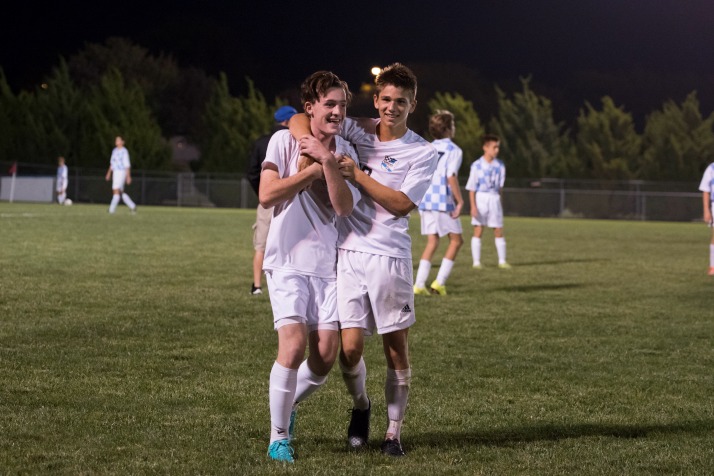 Seniors Luke Ramey and Oliver Bihuniak celebrate after the Lancers' 3-1 win over Olathe North on Tuesday. (Contributed by David Morantz)
