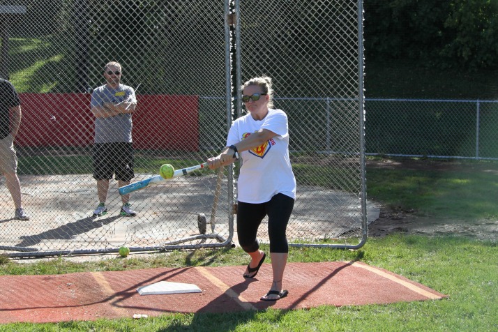 Carolyn Macan, Bo Macan's mother, connects on a softball during Bombs 4 Bo.