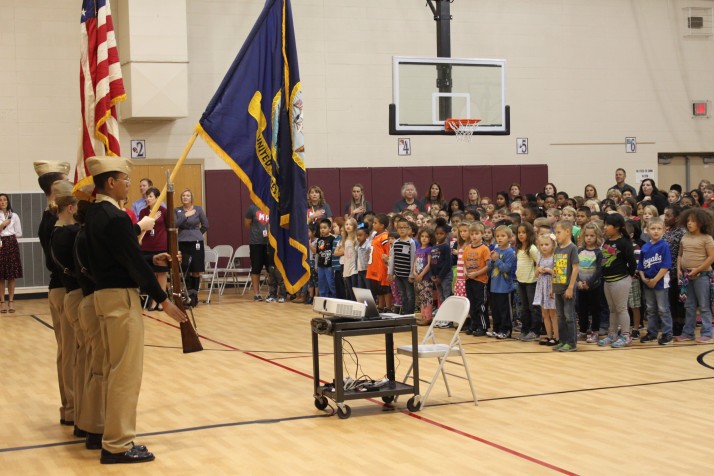 The Shawnee Mission North color guard began the school assembly at Merriam Park Elementary.