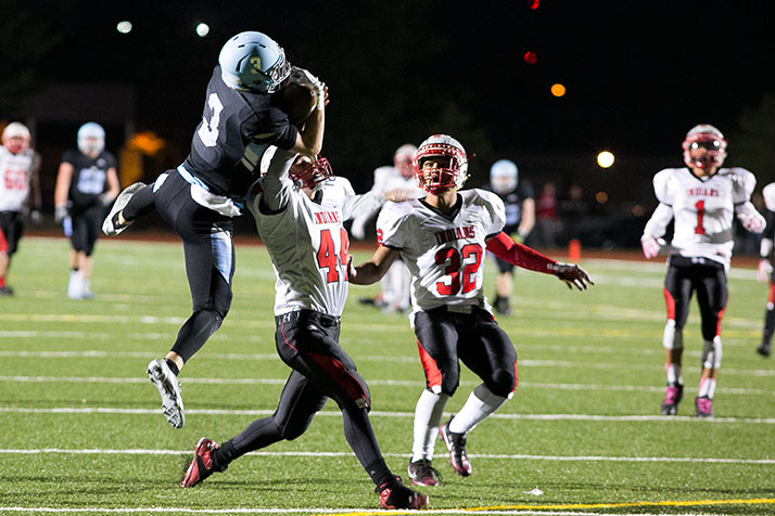 Trevor Thompson wrested the ball away from Spencer Dubois for a 63-yard gain that set up an SM East touchdown by Nigil Houston a few plays later.