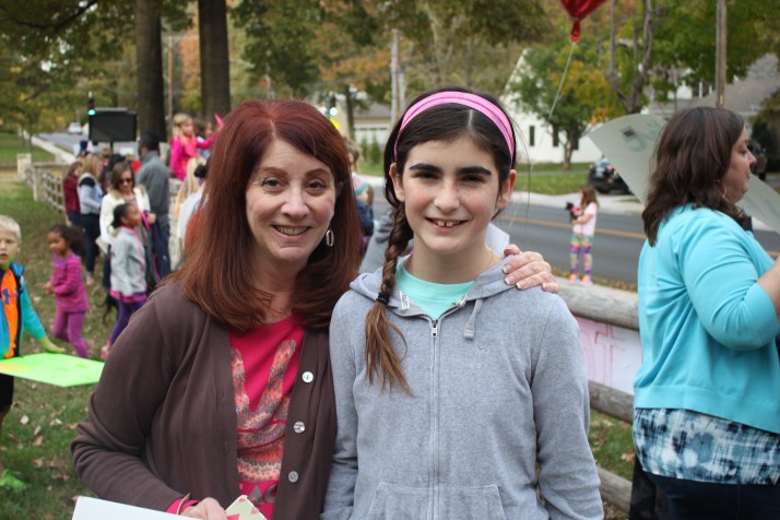 (From left) Dawn Thibodeau and daughter Maddie helped organize the "Kids Rally for Peace."