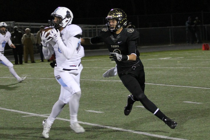 Sophomore defensive back Isaiah Wright picks off Blue Valley quarterback Matt Dercher on the first drive of the game.