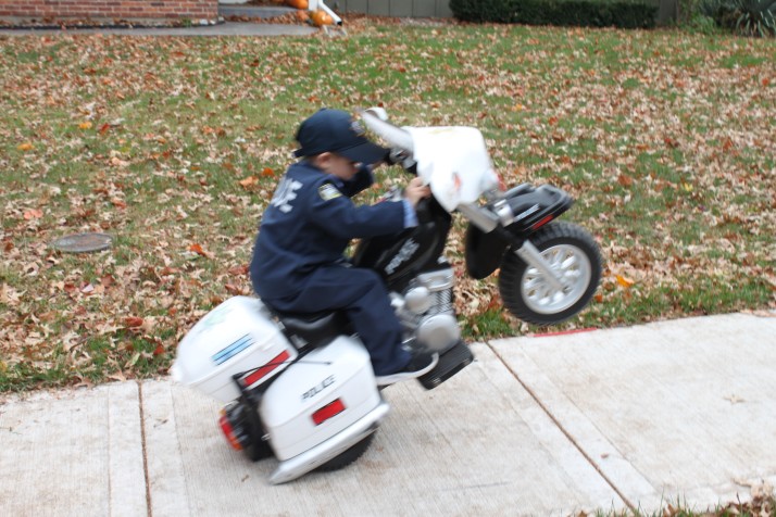 Officer Oliver Davis pops one of his crowd pleasing wheelies.