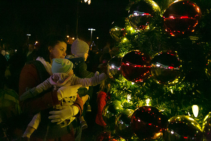 Youngsters explored the tree decorations after the lighting ceremony.