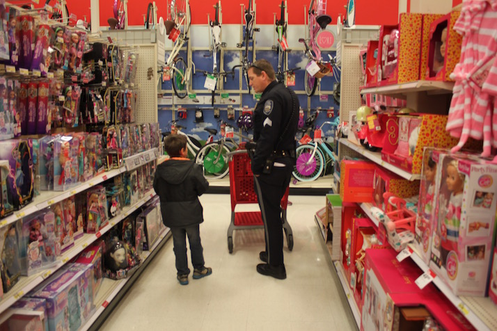 Sgt. Eric McCullough patiently listened to his seven-year-old shopper.