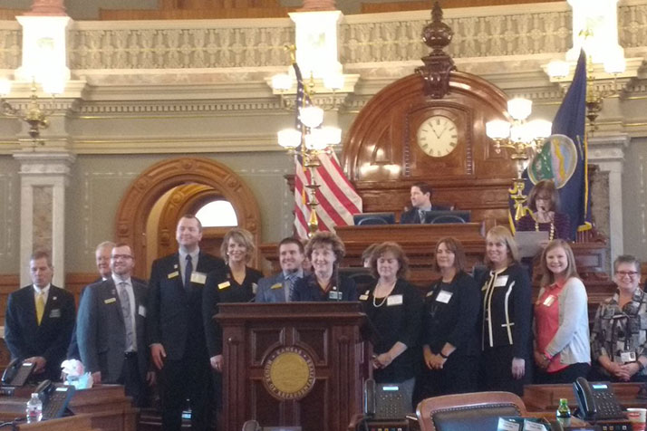 Ferrell, fourth from the left, and other Teacher of the Year finalists were honored on the floor of the House. Photo via Rep. Brett Parker on Twitter.