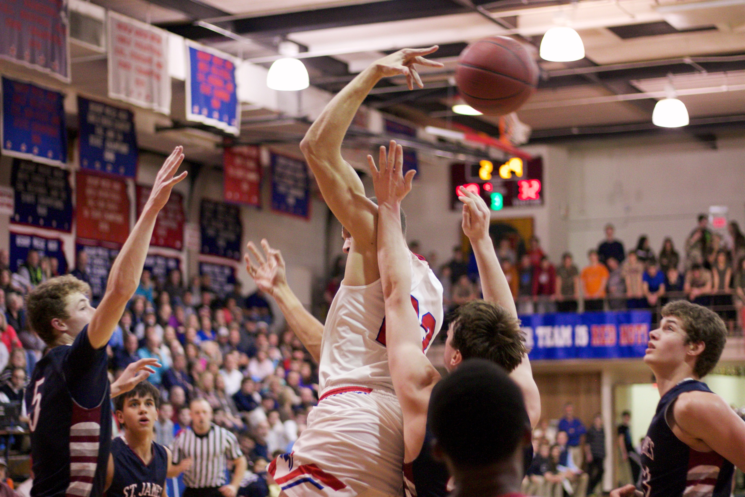 Bishop Miege's Francesco Badocchi flips a pass behind his head to Jeremiah Robinson-Earl.