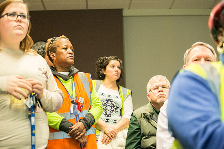 First Student employees wore their safety vests as they packed the school board chambers ahead of Monday's vote.