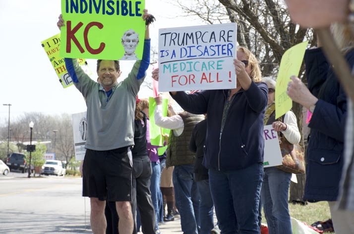 Advocates lined the street Thursday in front of Kevin Yoder's Overland Park office.