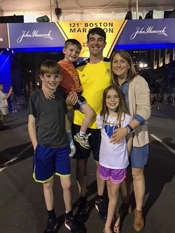 Mike Riley and his family at the Boston Marathon finish line. Riley is competing in his third Boston Marathon today.