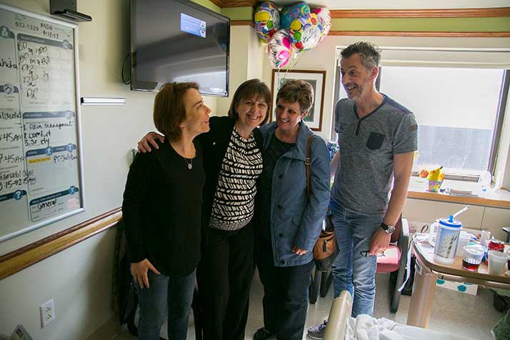 Anne-Sophie Rocuet (from left), Sandy Burgers, Laure Losey and Christian Burgers in Lottie's hospital room.