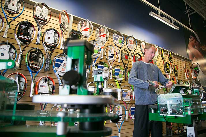 Matt Rodney strings up a racquet at The Tennis Set in Overland Park.