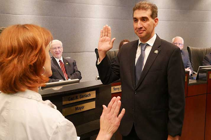 Faris Farrasati taking the council oath. Photo via city of Overland Park