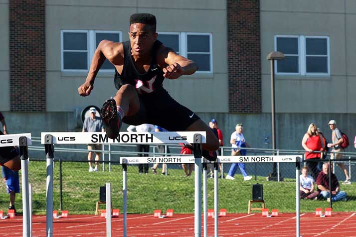 SM North's Ike Diggs took fourth in the 110-meter hurdles. Photo by Andrew Poland.