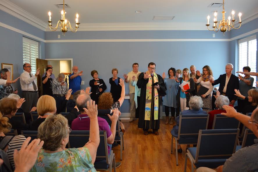 Senior Minister Aaron Roberts leading the dedication of the chapel Sunday. Photo courtesy Colonial Church.