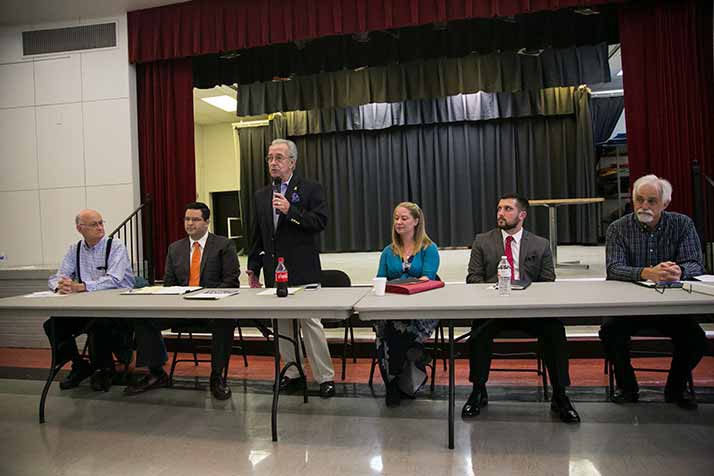 Candidates for public office (from left) Roger Cooper, Mike Kelly, Tom Madigan, Jen Hill, Leonardo Tocco and Jim Kelly participated in a forum at the Roeland Park Community Center Monday.