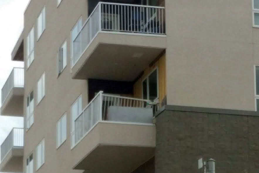 Crews worked to repair damage to the exterior of the building from water infiltration.