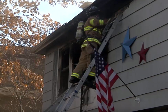 Fire crews battling the blaze at the home on W. 91st Street. Photo via OPFD.