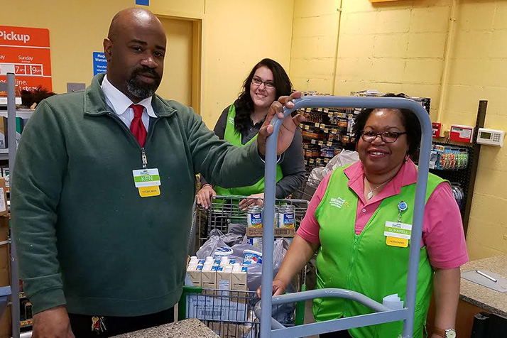 Walmart employees helped put the meals together and donated hundreds of dollars worth of food.