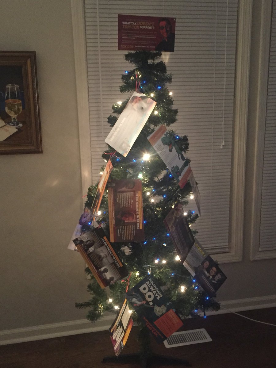 Rep. Tox Cox has decorated a small Christmas tree with many of the negative mailers American for Prosperity has produced against him.