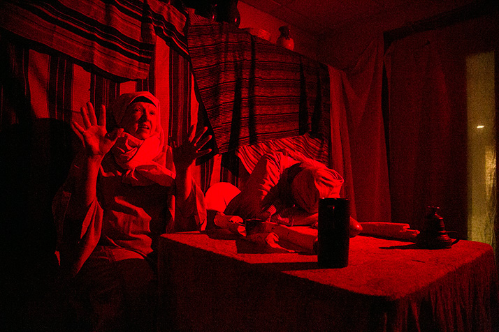 The innkeepers talk to travelers about the family they directed to their manger.