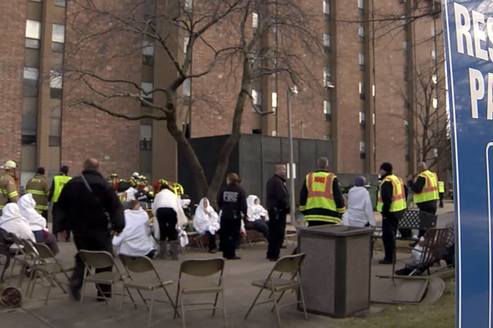 Fire crews provided blankets for residents of the Overland Towers Apartment displaced during Monday's fire. Video still courtesy Overland Park Fire Department.