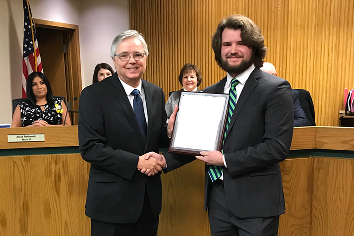 Ron and Quinn Appletoft with the plaque from Rep. Yoder's office. Photo courtesy city of Mission.