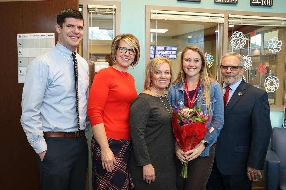 District leaders congratulated Ali Mackenzie after she learned she'd won the Kansas Horizon Award.