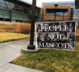 People are not mascots sign in front of Center for Academic Achievement