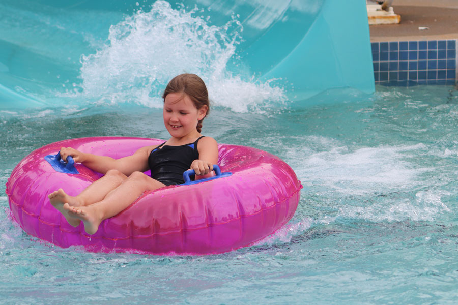 Prairie Village pool patron uses slide